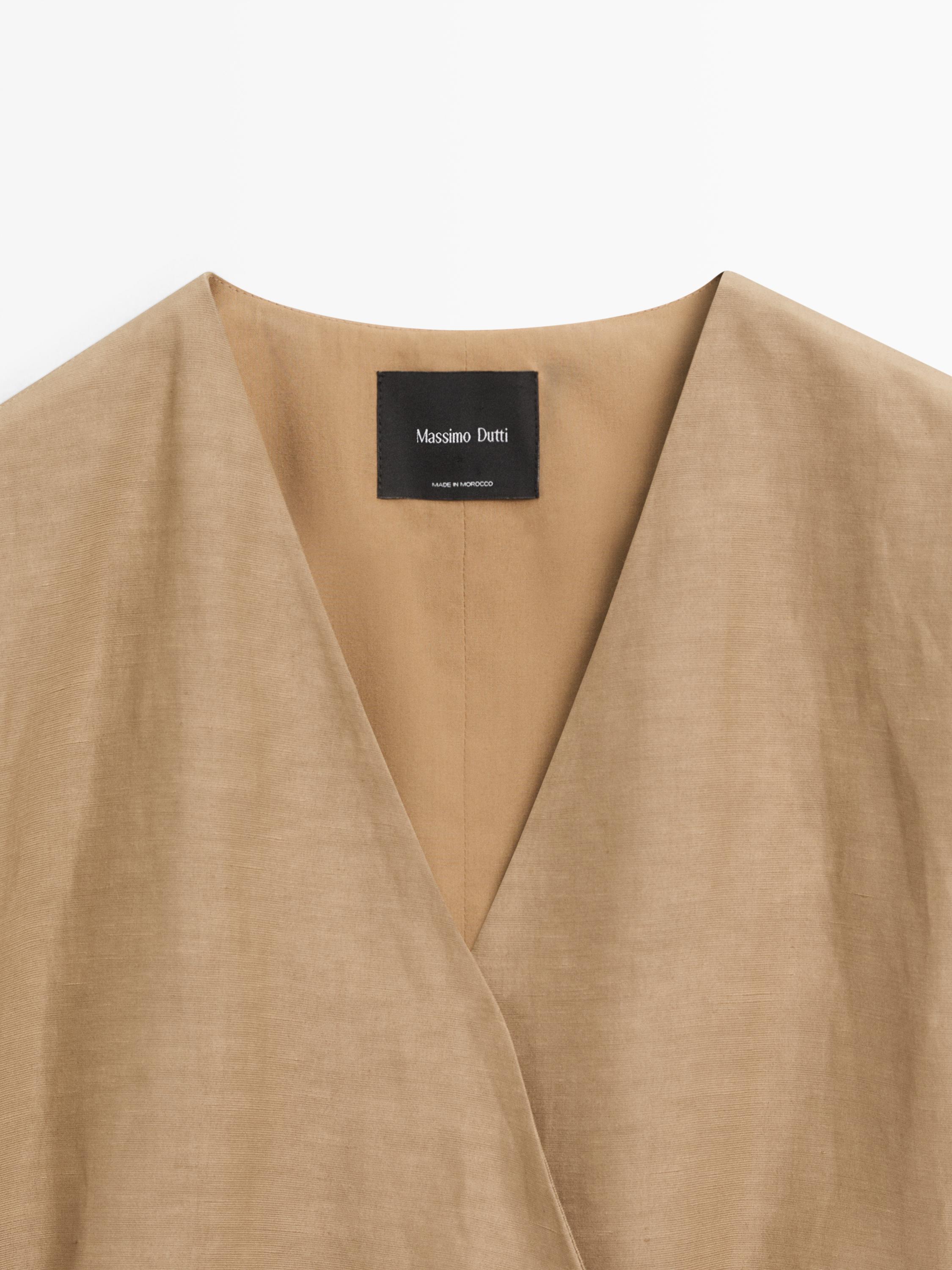 Veste longue cache-cœur sans manches